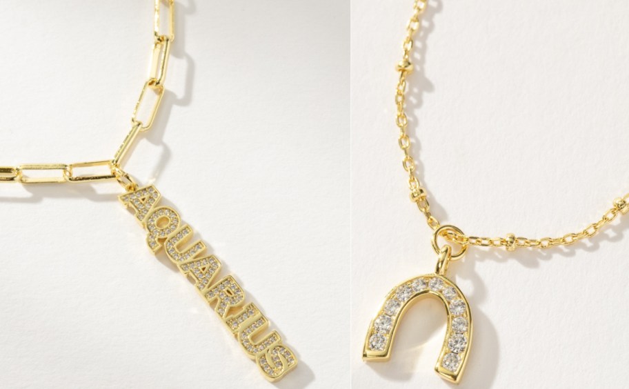 Two gold-tone necklaces displayed side by side: one with a paperclip chain and a vertical pav&eacute;-set "AQUARIUS" word pendant, and another with a delicate beaded chain and a sparkling horseshoe pendant.