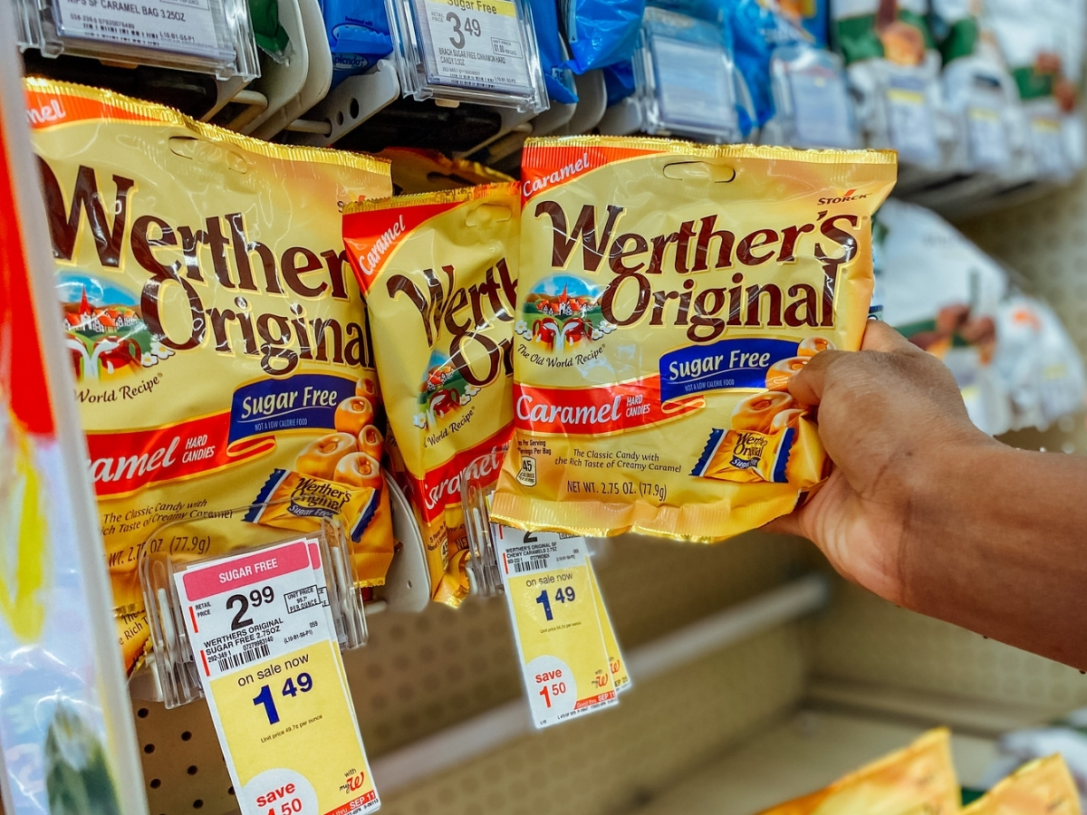 hand holding werther's original caramels