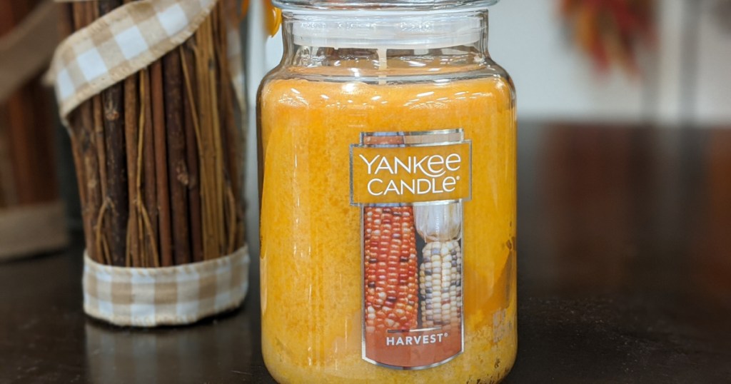Yankee brand yellow candle on counter
