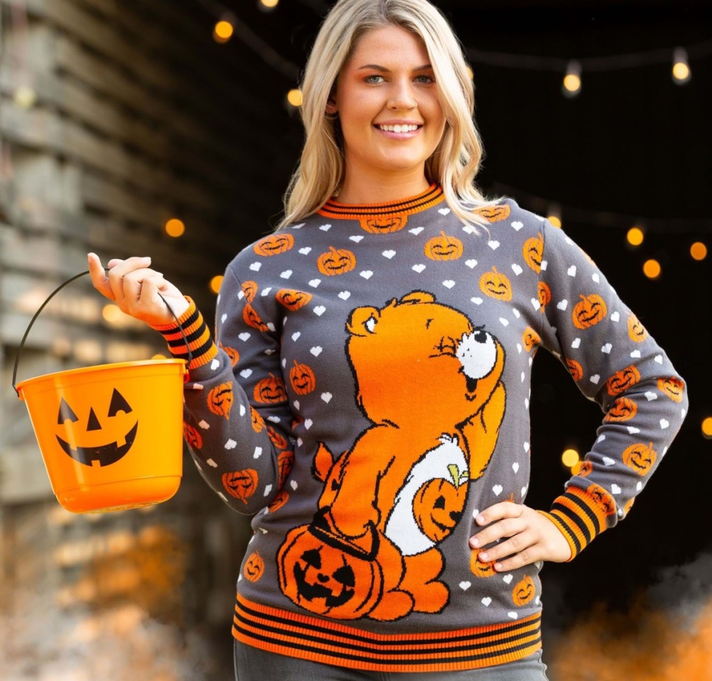 woman wearing Care Bear Halloween sweater