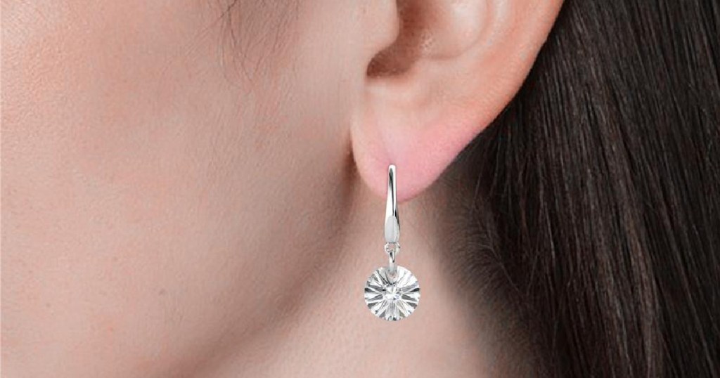 close up of woman wearing earrings