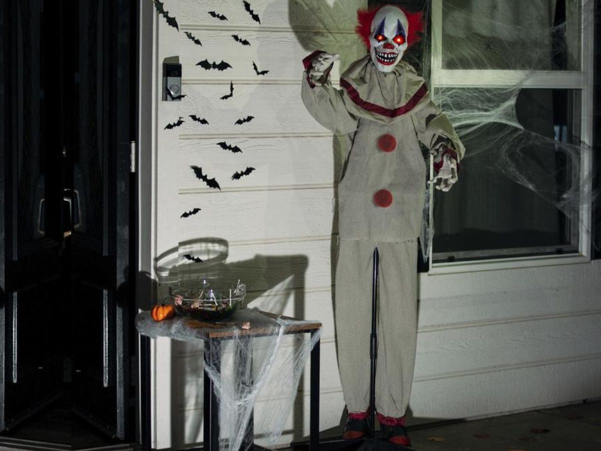 scary clown decoration on front porch