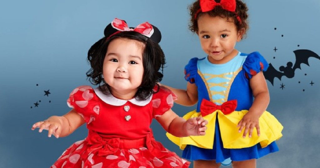 two girls in minnie mouse and snow white costumes