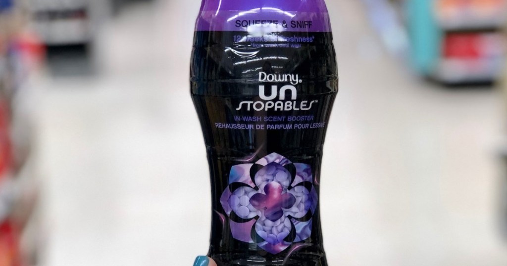 Downy lush Unstopables container held by a hand in a store