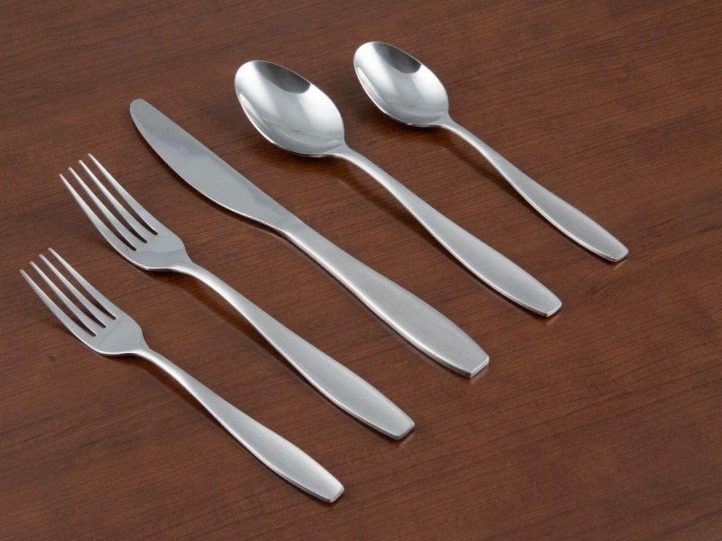 flatware on brown surface