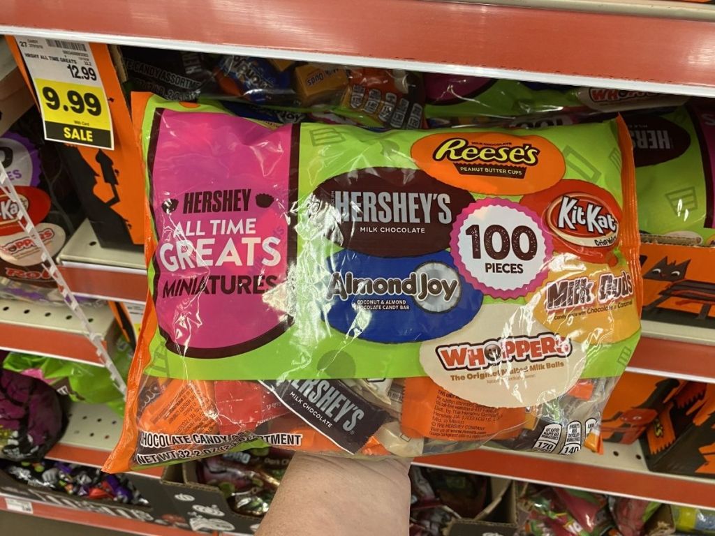 holding a bag of halloween candy