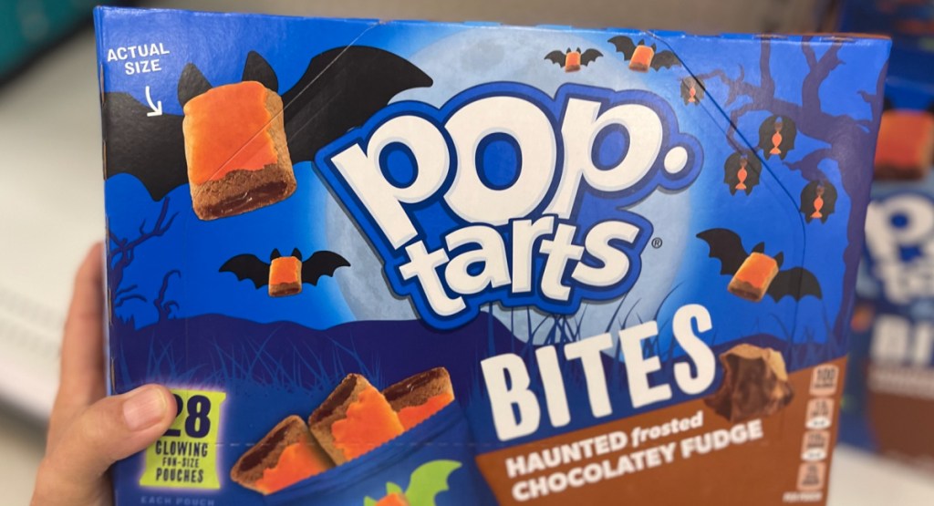 hand holding Kellogg's Pop Tarts Bites Freaky Frosted Chocolatey Fudge 28 Count