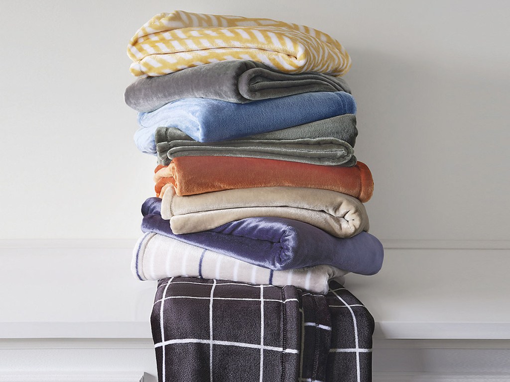 stack of velvet throw blankets