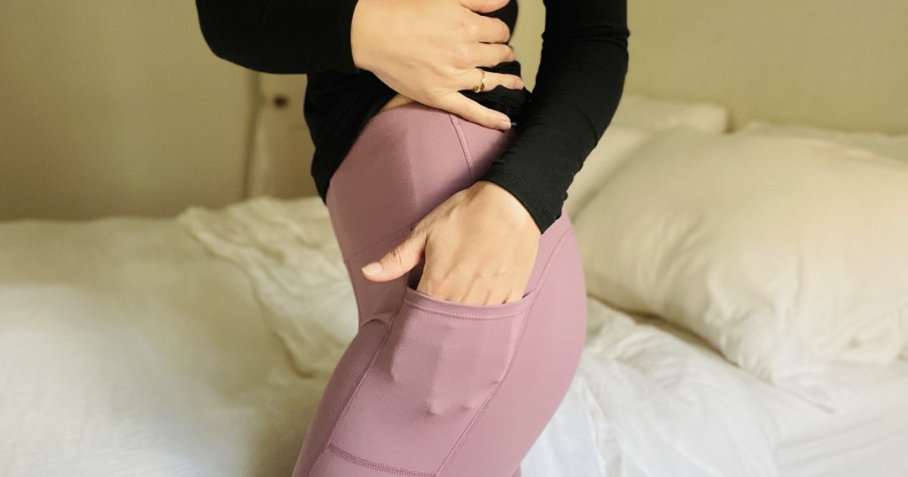 woman showing ikeep yoga pants w/ pockets