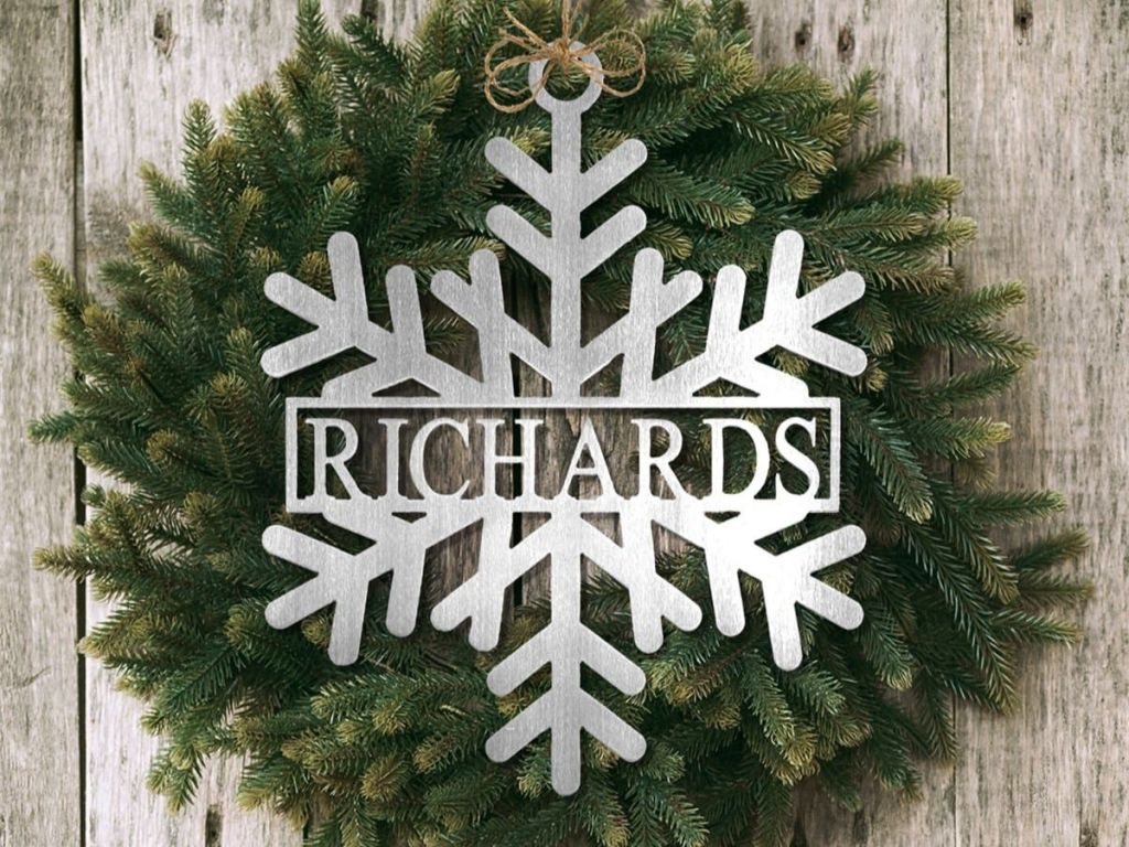 snowflake name sign in front of wreath