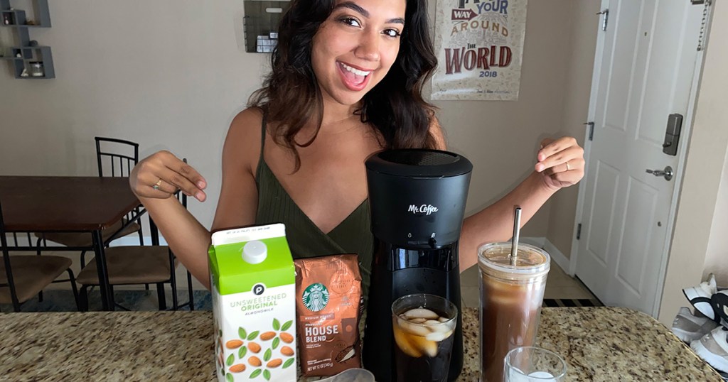 woman with mr coffee iced coffee maker and iced coffee ingredients