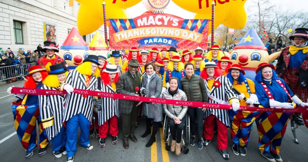 Cutting the ribbon at the Macy's Thanksgiving Day Parade