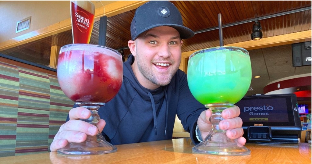 man with colorful cocktails