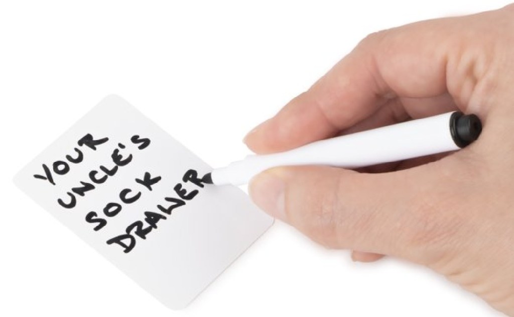 hand writing on words on card in black felt