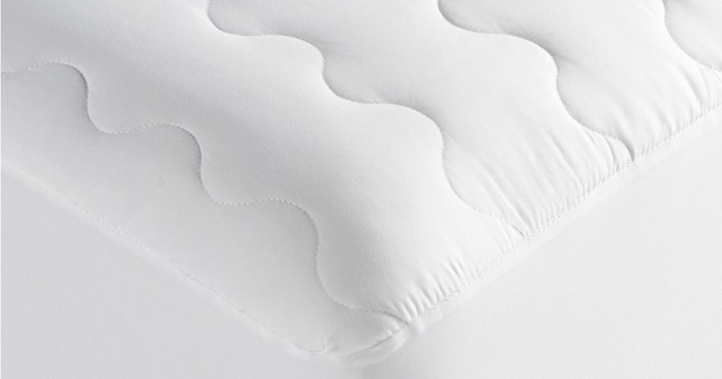 white mattress pad on a mattress