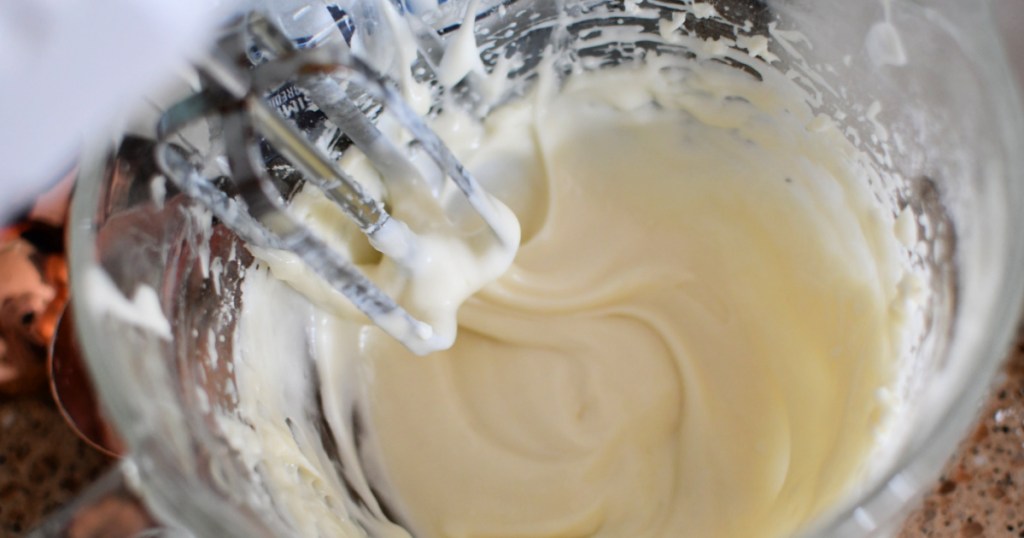 mixing icing for cinnamon rolls