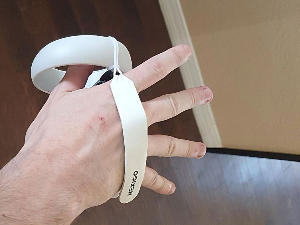 hand wearing nexico hand grip gaming accessory