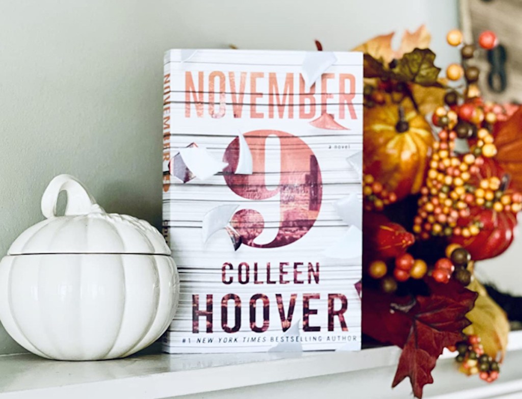 november 9 book sitting on mantel with fall decor