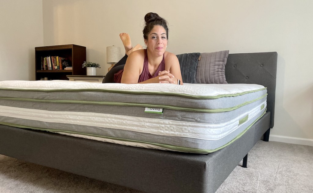 woman laying on bare novilla mattress