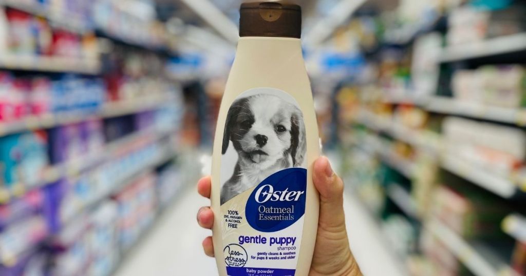 hand holding Oster dog shampoo