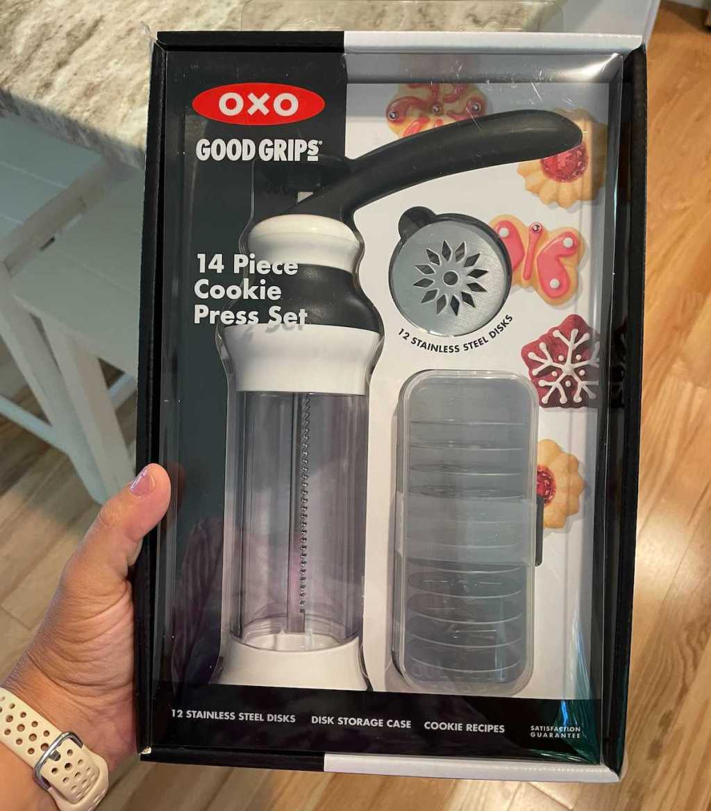 hand holding oxo cookie press in box