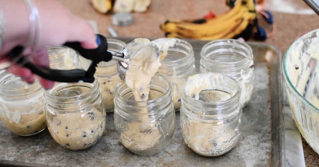 pouring banana bread batter into a jar