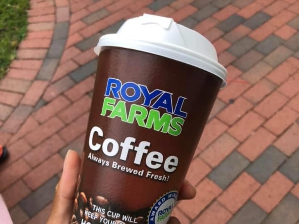holding a coffee cup from Royal Farms