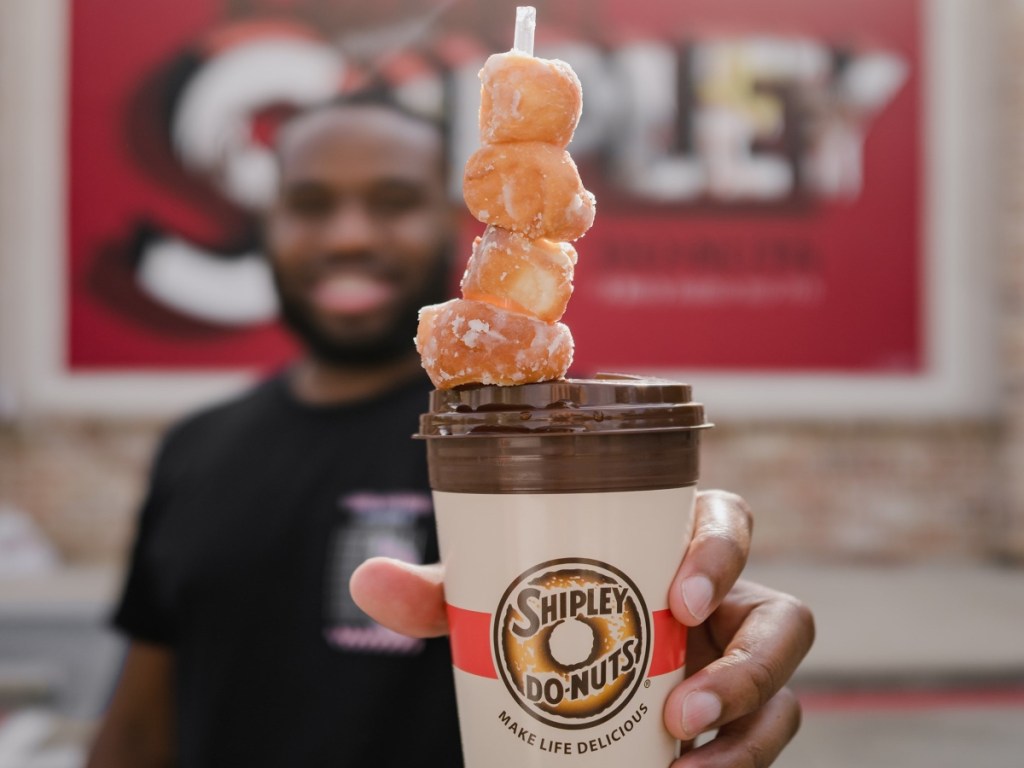 doughnut holes on top of a coffee cup