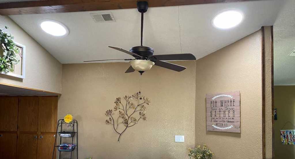 two circle lights on ceiling with fan