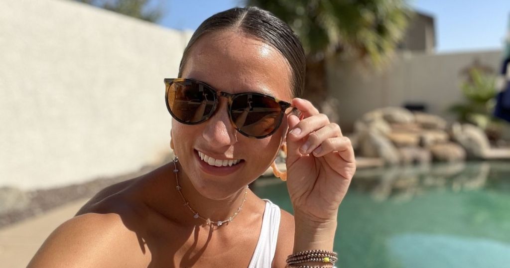 woman wearing sungait sunglasses near pool