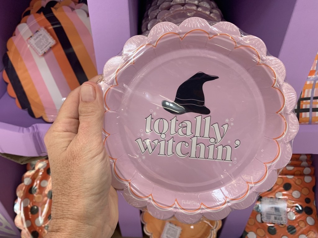holding Halloween party plates