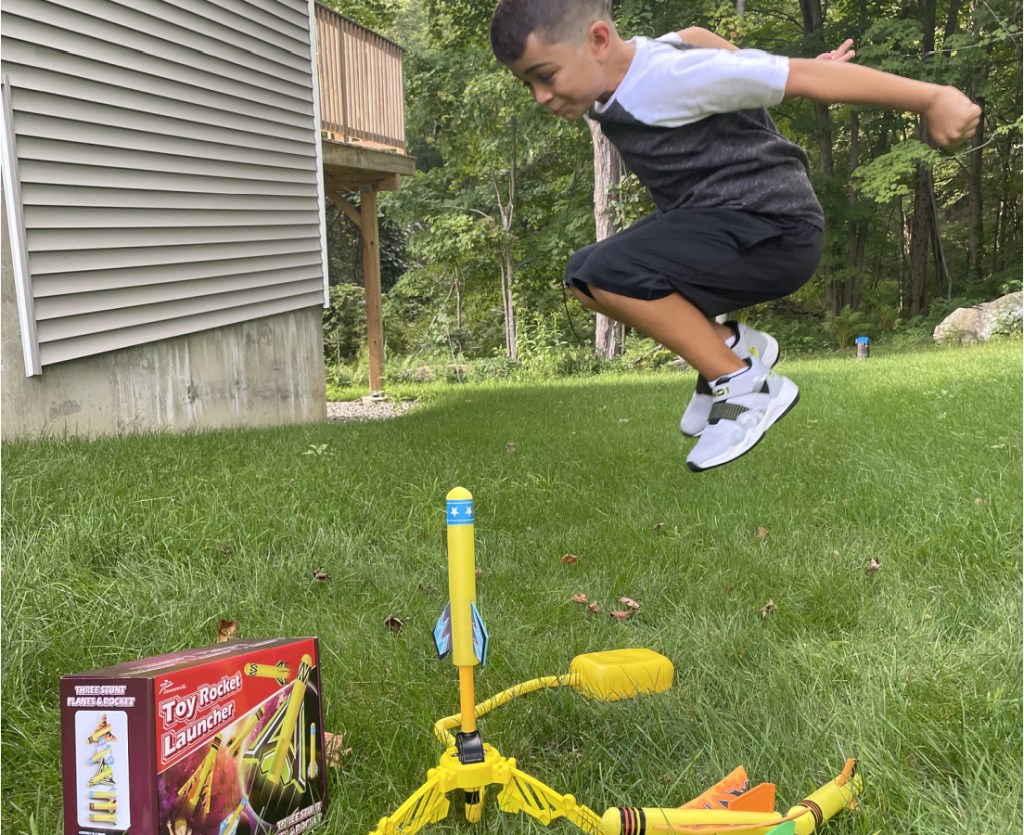 kid jumping on Toy Rocket Launch Pad