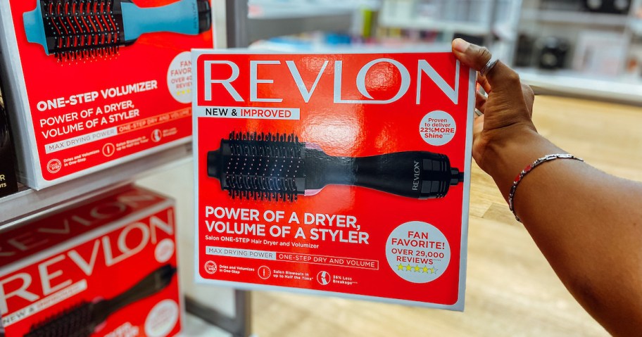Holding a Revlon One Step Hair Dryer at an Ulta Hair event.