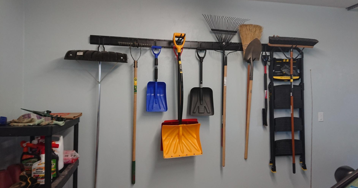 garage tools hung on a steel organizer