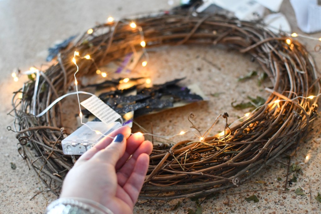 weaving fairy lights in a wreath