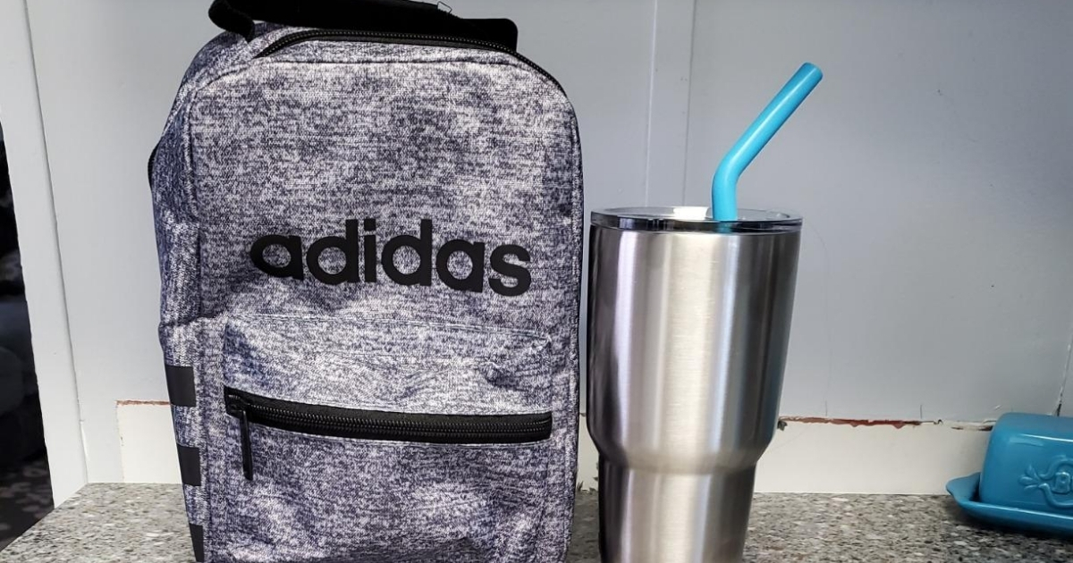 adidas gray santiago lunch bag on counter with reusable cup