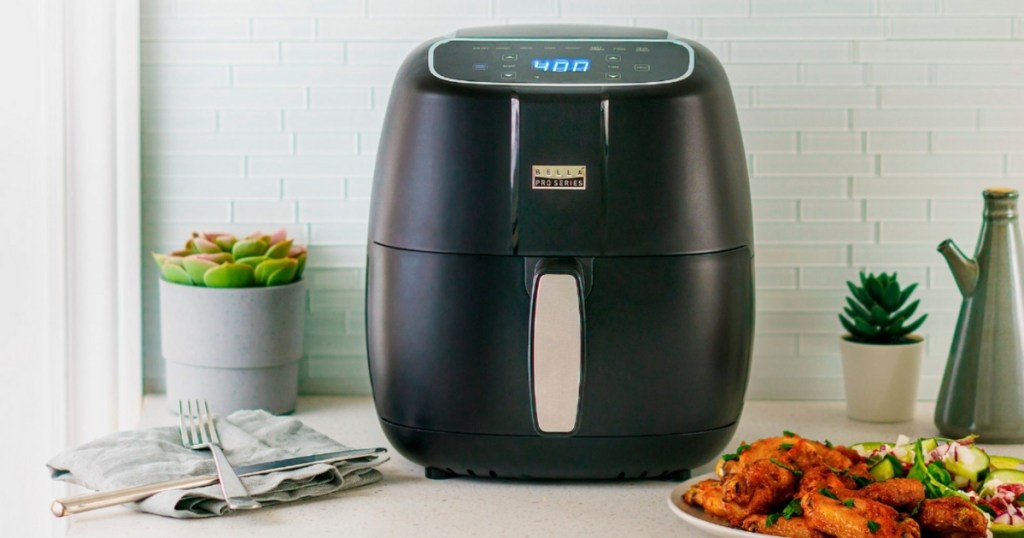 bella pro series 4qt air fryer on table with food