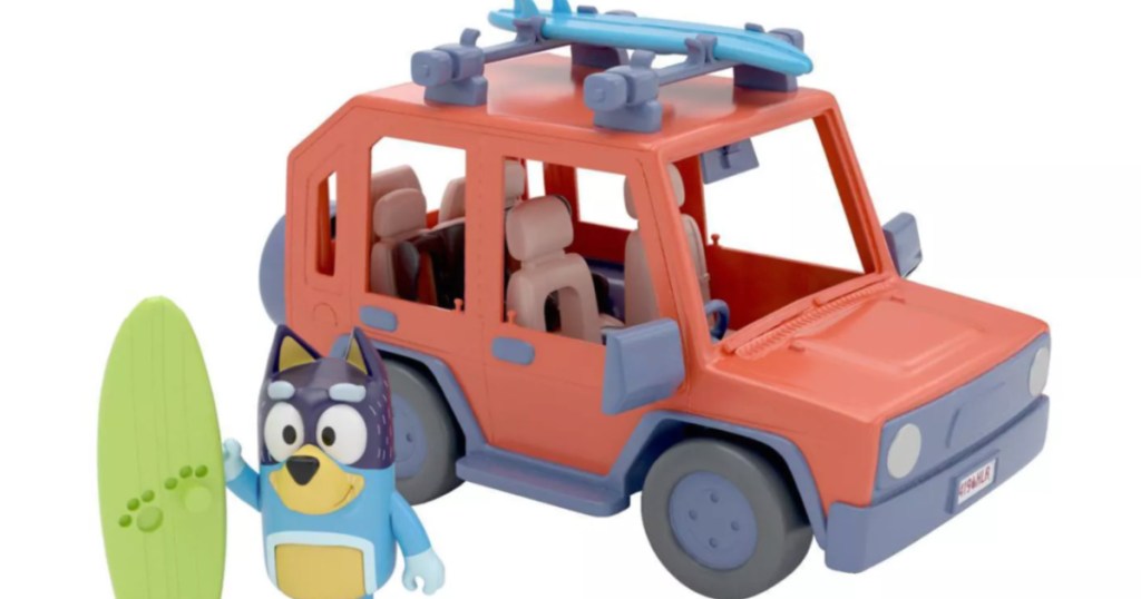 toy car with toy dog in front 