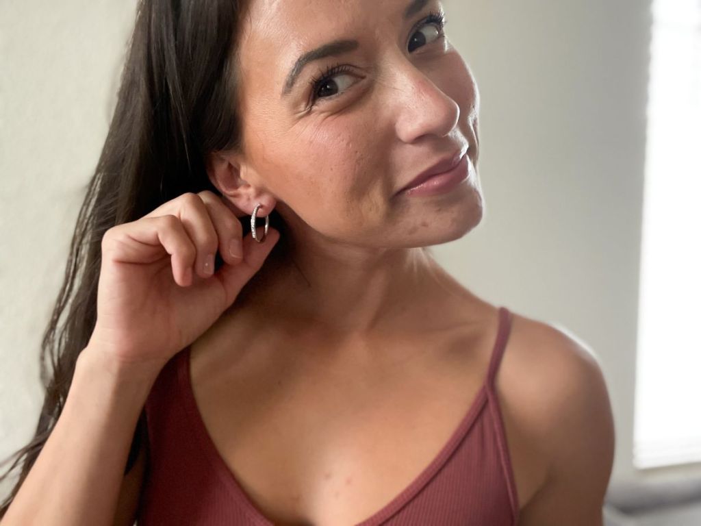 woman wearing a pair of earrings