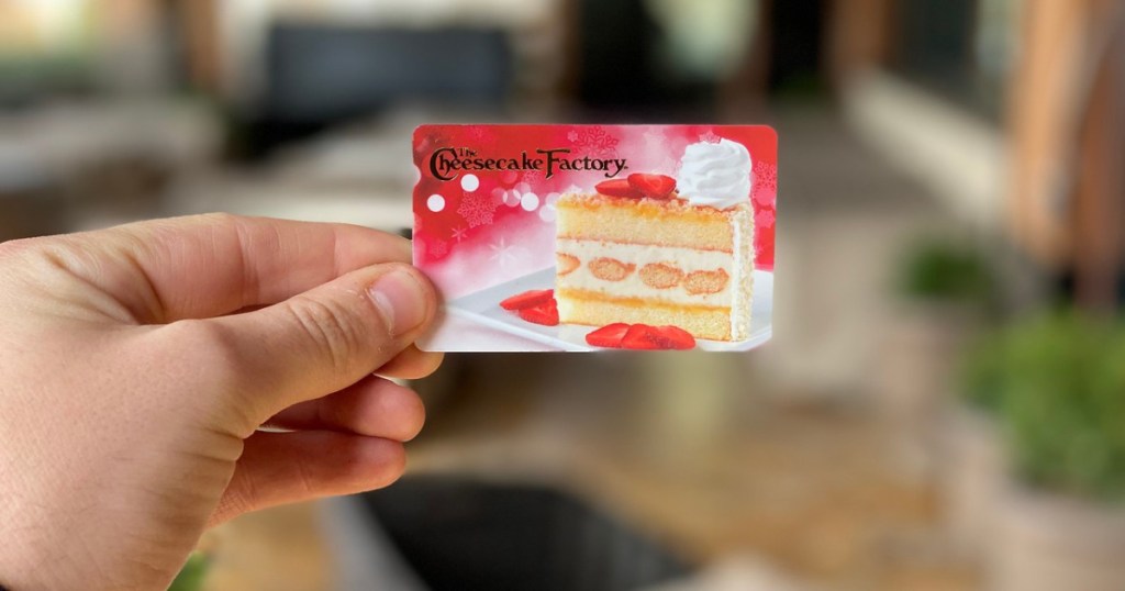 person holding a Cheesecake Factory gift card