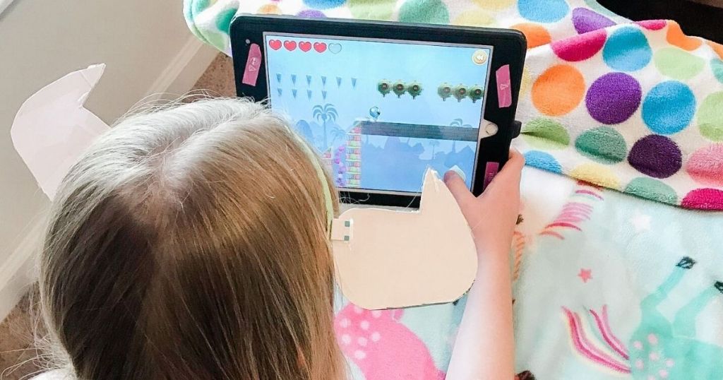 girl playing on a tablet