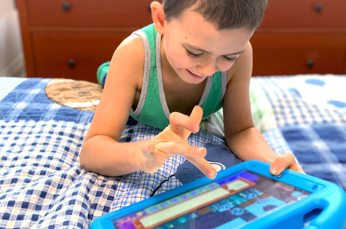 boy playing on a tablet