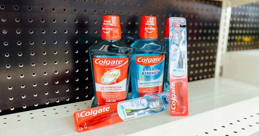 two bottles of mouthwash and two toothbrushes on store shelf