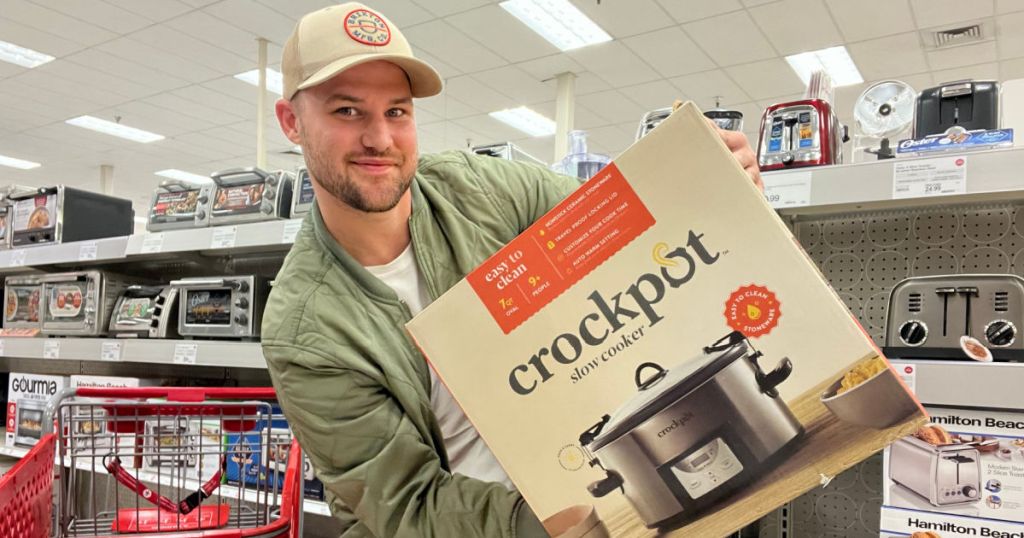 man holding crockpot in box 