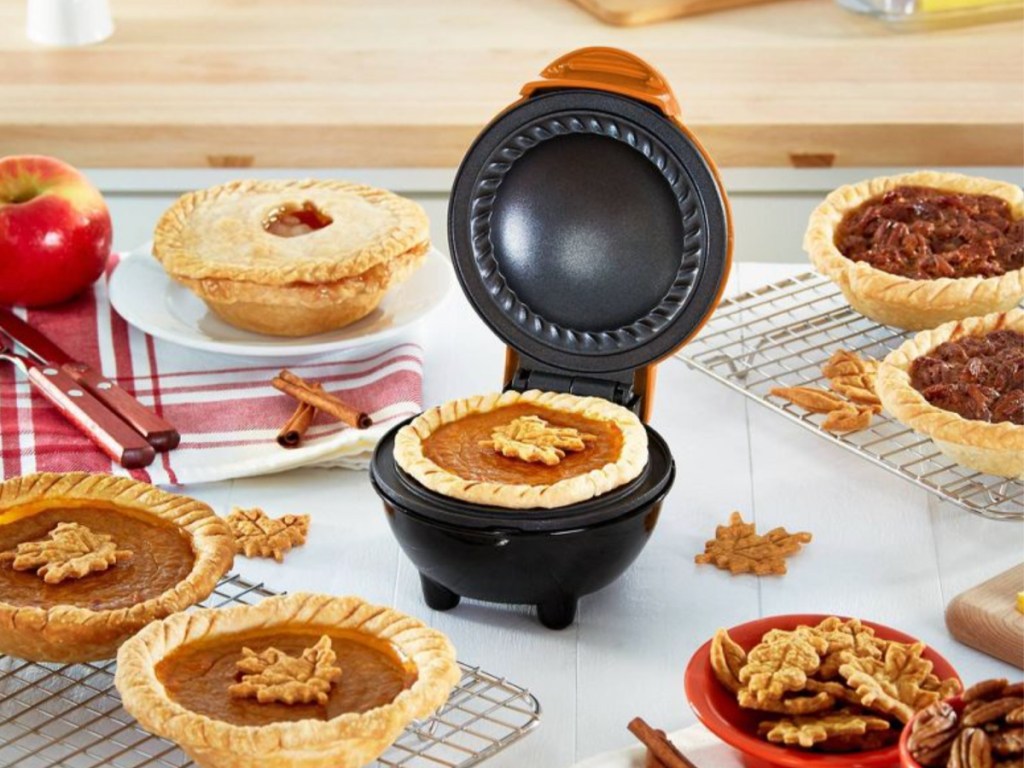 Dash Mini Pie Maker filled with pumpkin pie on display on table