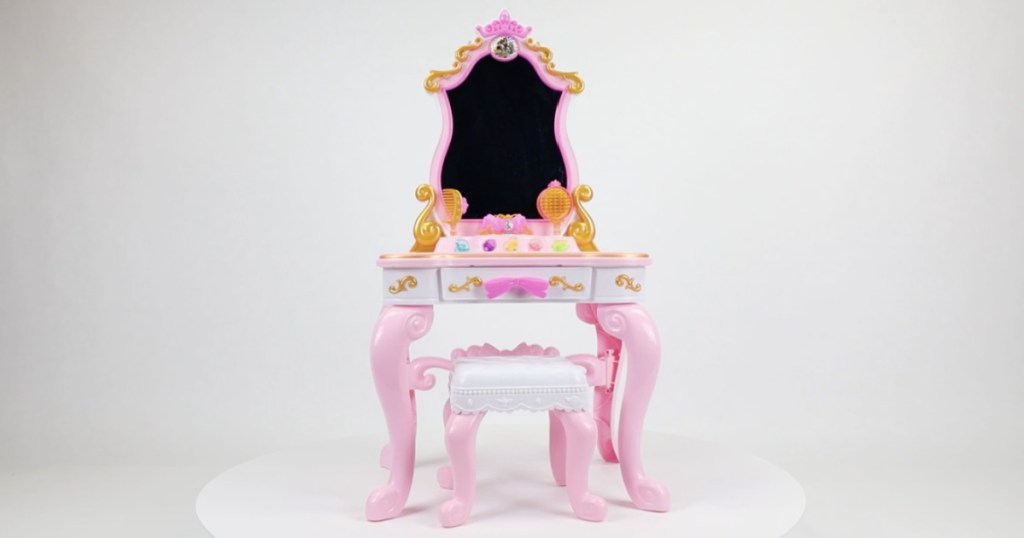 pink, white and gold toy vanity