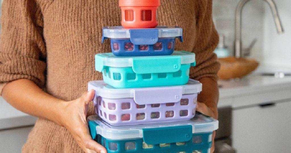woman holding multicolor plastic food storage 