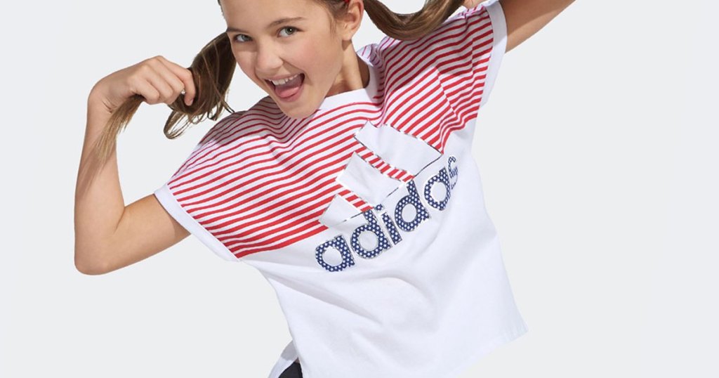 girl in red and white adidas shirt