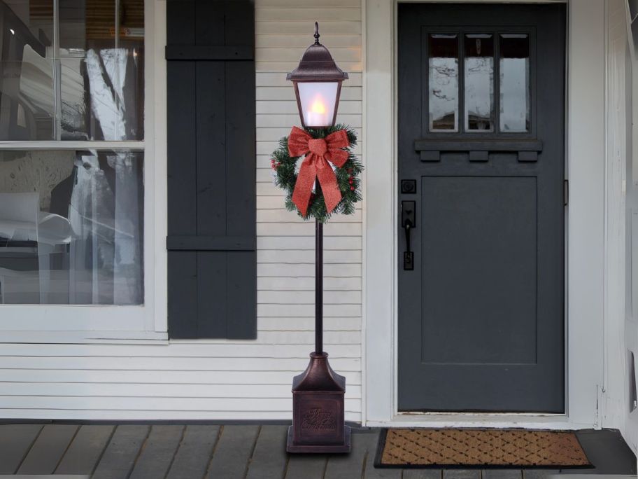 Holiday Time 4' Pre-Lit Battery-Operated Christmas Lamp Post w/ Timer at front door