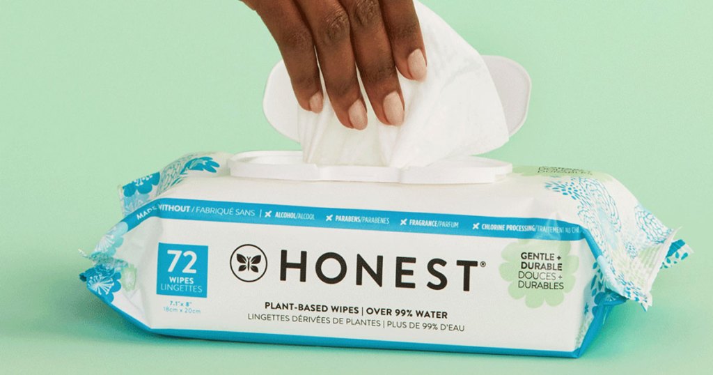 pulling baby wipe from honest company pack